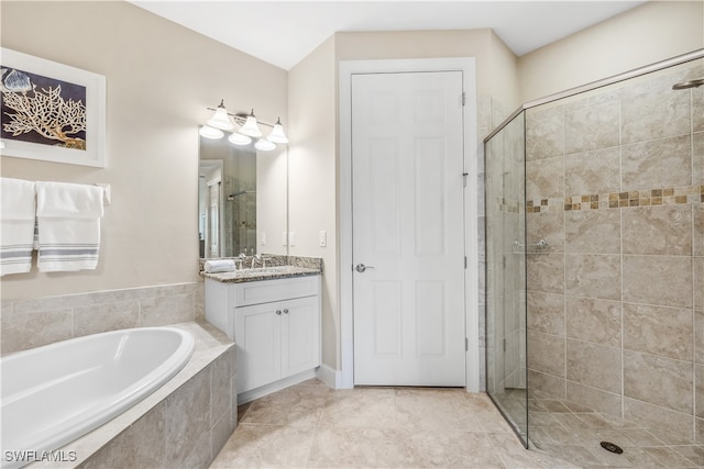 bathroom with tile patterned flooring, vanity, and independent shower and bath