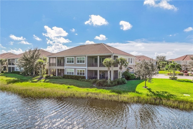 rear view of property featuring a water view