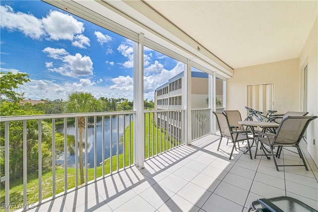 unfurnished sunroom with a water view