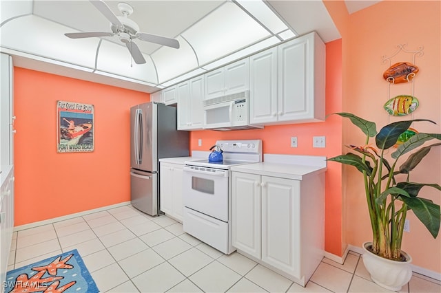 kitchen with light tile patterned flooring, white appliances, white cabinetry, and ceiling fan