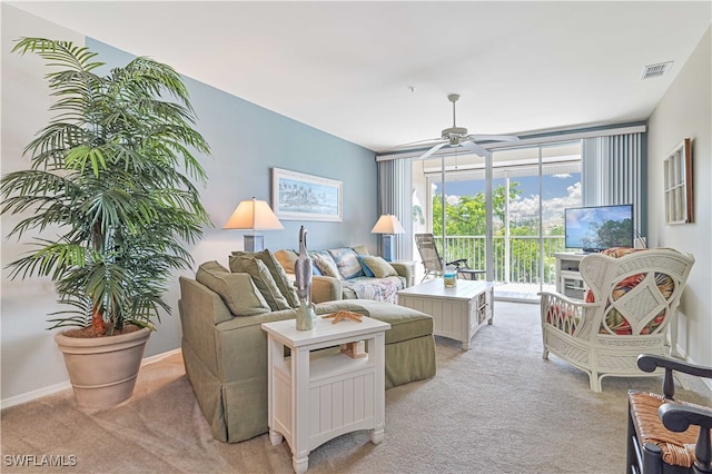 living room with ceiling fan and light carpet