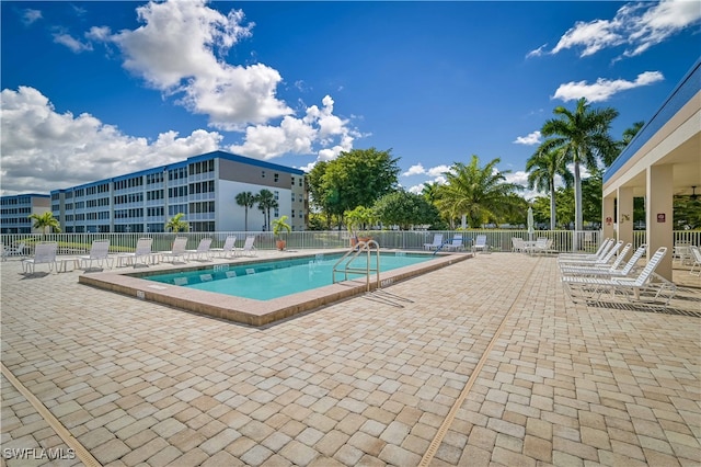 view of swimming pool with a patio area