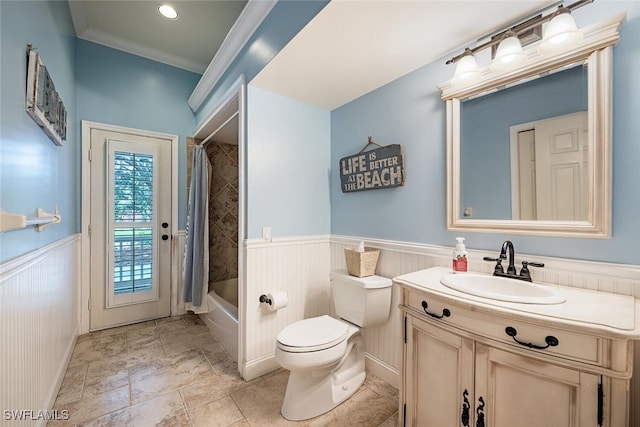 full bathroom featuring crown molding, vanity, toilet, and shower / bath combination with curtain