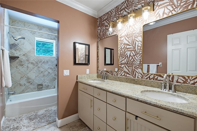 bathroom featuring tiled shower / bath combo, vanity, and ornamental molding