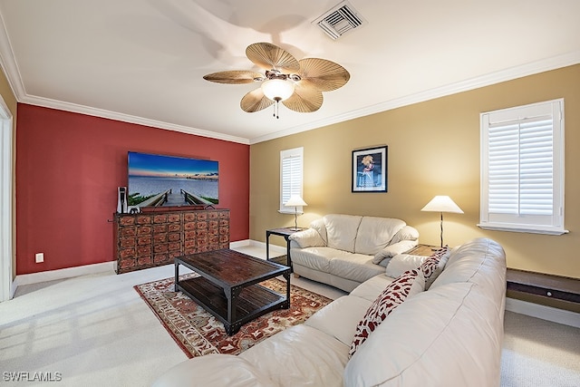 living room featuring ceiling fan, light colored carpet, and crown molding