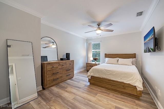 bedroom with crown molding, light hardwood / wood-style flooring, and ceiling fan