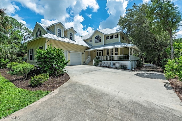 view of front facade featuring a garage and covered porch