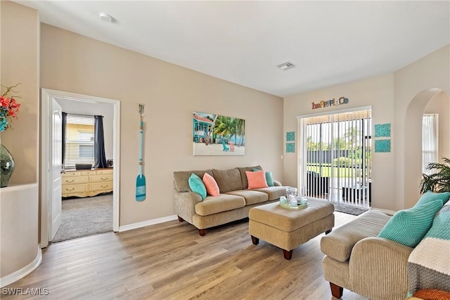 living room with light hardwood / wood-style flooring