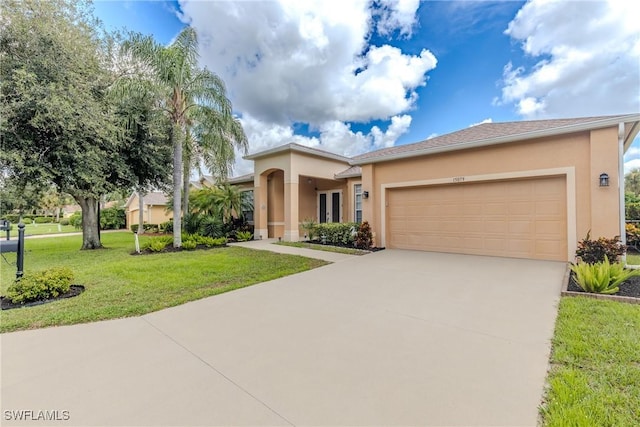 view of front of house with a front yard and a garage