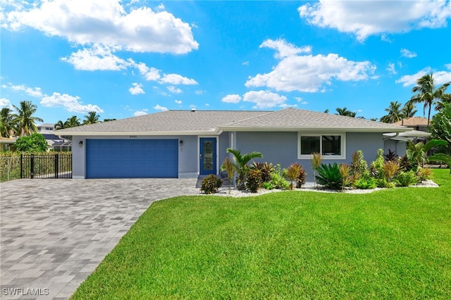 ranch-style house with stucco siding, an attached garage, fence, and decorative driveway