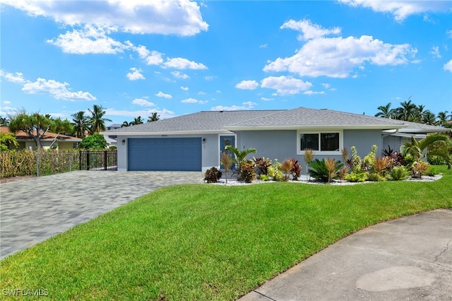 ranch-style house featuring fence, decorative driveway, a garage, stucco siding, and a front yard
