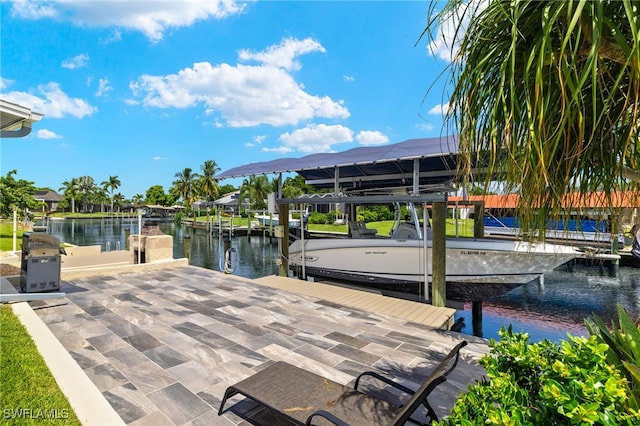 dock area with a water view and boat lift