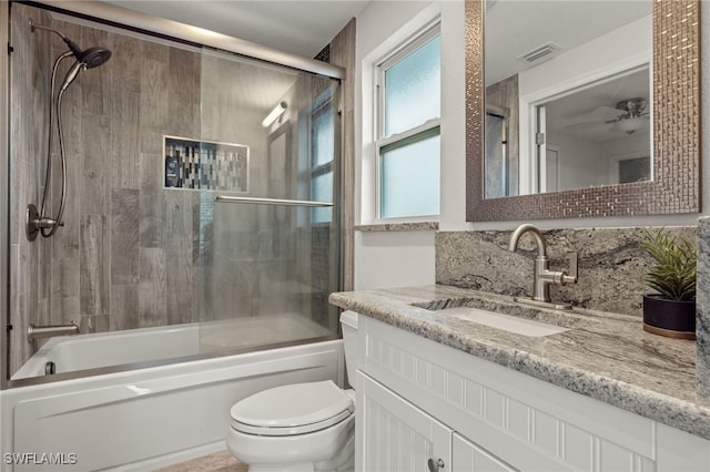 full bath featuring toilet, enclosed tub / shower combo, visible vents, backsplash, and vanity