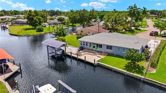 drone / aerial view featuring a water view and a residential view