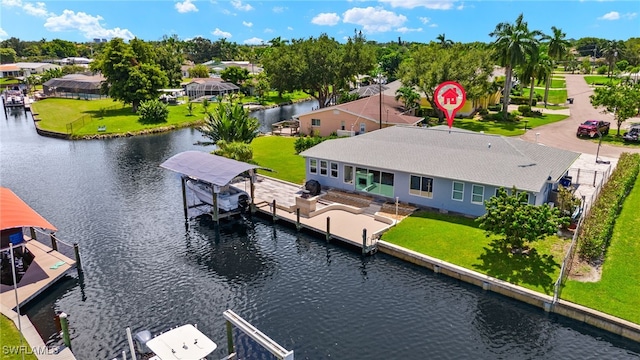 birds eye view of property with a water view and a residential view