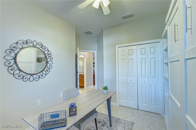 tiled home office with ceiling fan