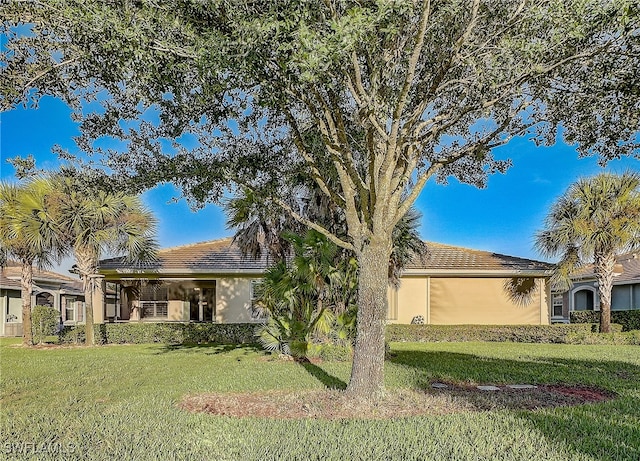 view of side of home featuring a yard