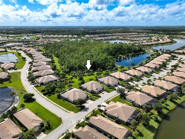 birds eye view of property featuring a water view