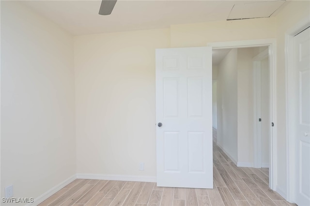 empty room featuring ceiling fan and light wood-type flooring