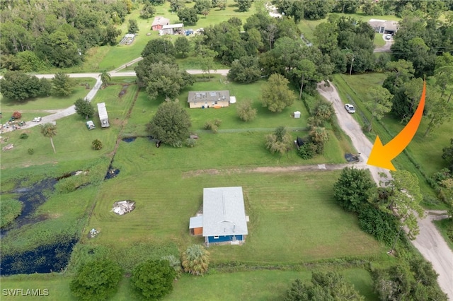 birds eye view of property with a rural view