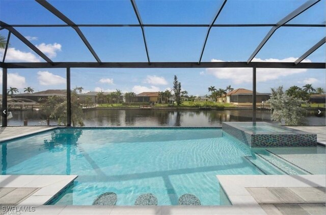 view of pool featuring a water view, a lanai, and a patio area