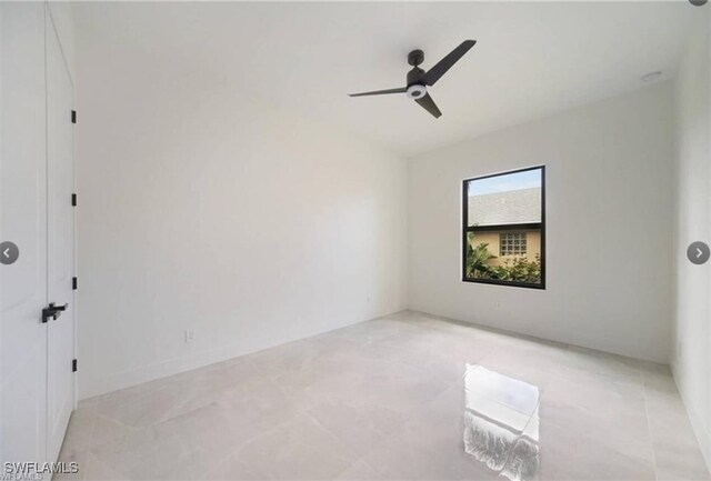 unfurnished room with ceiling fan