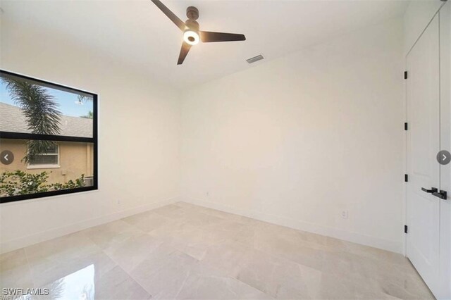 unfurnished room featuring ceiling fan