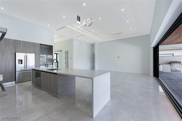 kitchen featuring a kitchen island with sink, appliances with stainless steel finishes, and sink