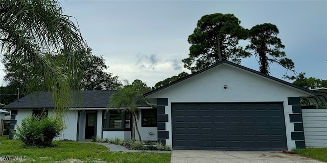 ranch-style home featuring a garage