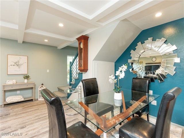 dining room featuring light hardwood / wood-style floors and beam ceiling