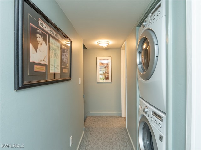 laundry room with stacked washer and clothes dryer