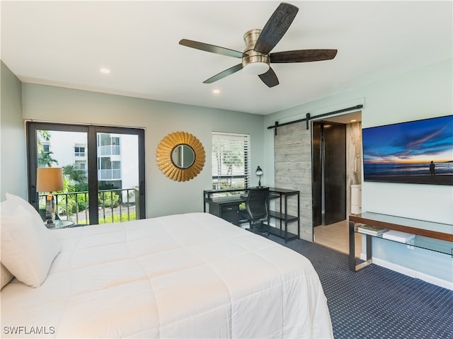 bedroom with ceiling fan, a barn door, access to exterior, and multiple windows