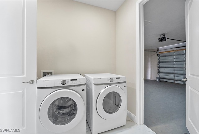 washroom featuring light colored carpet and washer and clothes dryer