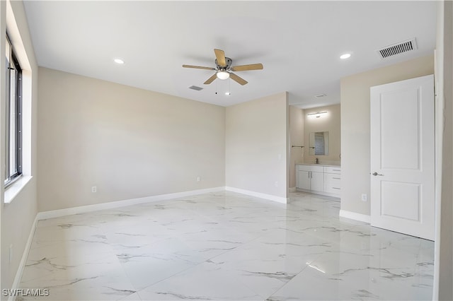 unfurnished room featuring ceiling fan