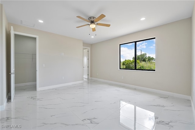 empty room featuring ceiling fan