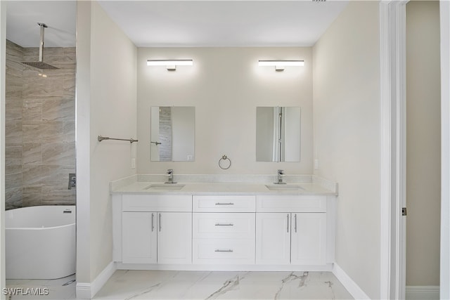 bathroom with vanity and shower with separate bathtub