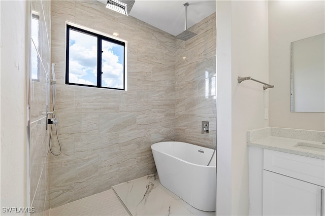 bathroom featuring vanity, tile walls, and plus walk in shower