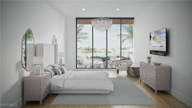 750 Goodlette-Frank Rd N Unit 202, Naples, FL 34102 - bedroom featuring floor to ceiling windows, a notable chandelier, and light hardwood / wood-style floors
