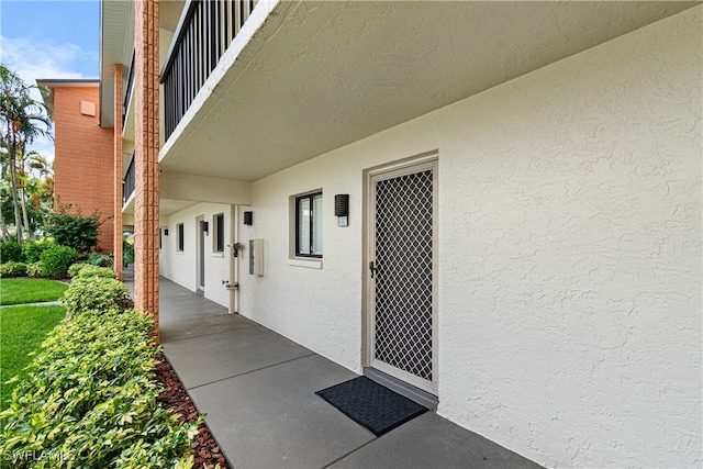 entrance to property with a balcony