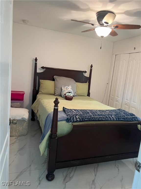 bedroom featuring a closet and ceiling fan