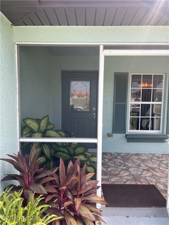 property entrance featuring covered porch