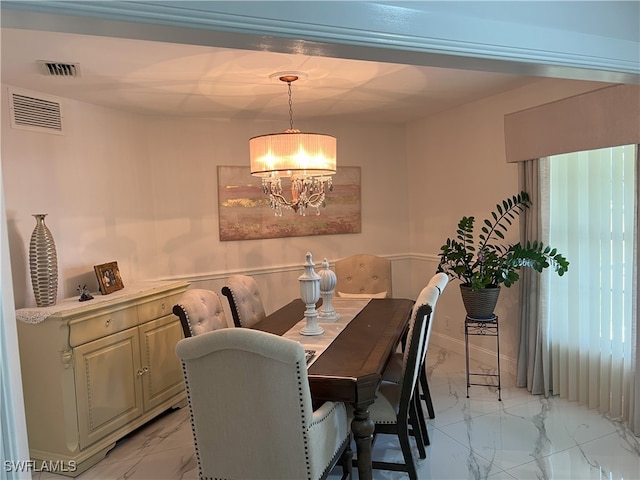 dining area with a chandelier