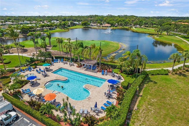 view of pool featuring a patio and a water view