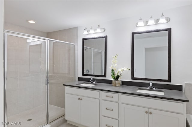 bathroom with vanity and an enclosed shower