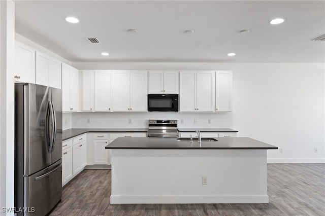 kitchen with sink, white cabinetry, a kitchen island with sink, and appliances with stainless steel finishes