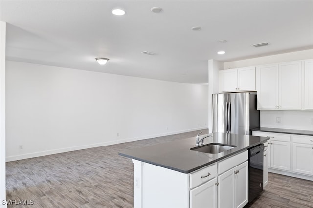 kitchen featuring stainless steel refrigerator, white cabinetry, sink, and black dishwasher