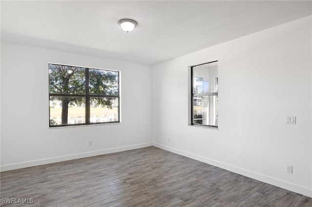 unfurnished room featuring wood-type flooring