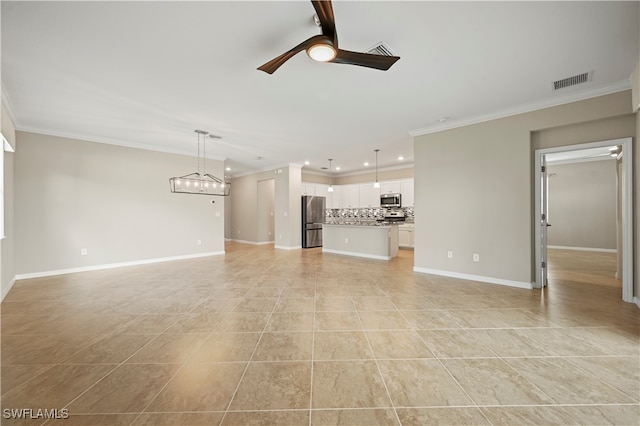 unfurnished living room with ornamental molding, ceiling fan with notable chandelier, and light tile patterned flooring