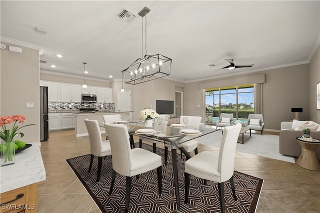 dining room with ceiling fan with notable chandelier, crown molding, and light tile patterned floors