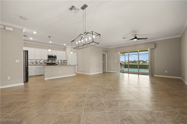 unfurnished living room with ceiling fan with notable chandelier, light tile patterned flooring, and ornamental molding